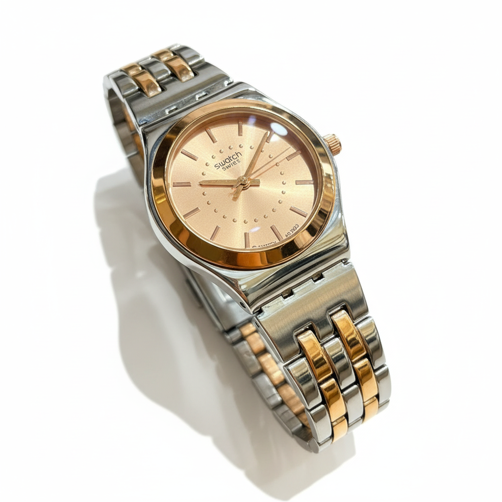 Swatch Champagne Dual Tone – L’Élégance Subtile au Fini Lumineux